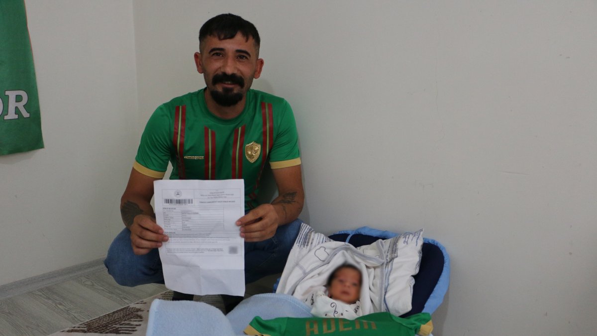 Amed Sportif fan Mehmet Yücel holds a birth certificate belonging to his son Adem Mbaye Diagne Yücel, Diyarbakır, Türkiye, Oct. 1, 2026. (IHA Photo)