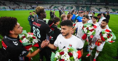 Konyaspor and Palestine national team players exchange flowers after the friendly match at Konya Büyükşehir Stadium, Konya, Türkiye, Sept. 30, 2026. (AA Photo)