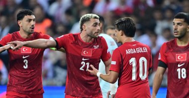 Türkiye's Barış Alper Yılmaz (2nd L) and Arda Güler (2nd R) discuss a play during the UEFA Nations League Group 1 League A match against France at Kocaeli Stadium, Kocaeli, Türkiye, Sept. 25, 2026. (AA Photo)