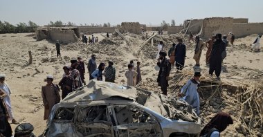 Locals survey the scene of Pakistani airstrikes in Helmand, Afghanistan, Oct. 1, 2026. (EPA Phto)