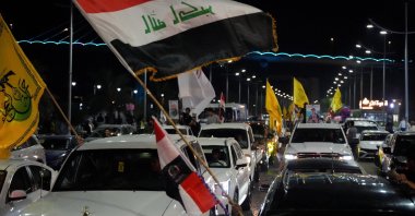Supporters of a Shiite armed group celebrate the withdrawal of U.S.-led coalition forces, in Basra, Iraq, Sept. 30, 2026. (Reuters Photo)