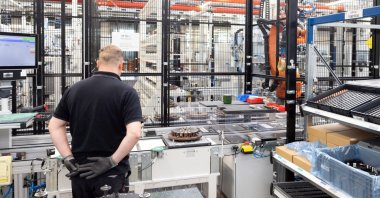A worker assembles axial-flux motors for electric vehicles on an assembly line at the Mercedes-Benz engine factory, Berlin, Germany, June 9, 2026. (Reuters Photo)