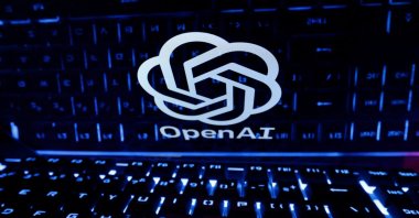 A keyboard is placed in front of a displayed OpenAI logo in this illustration taken Feb. 21, 2023. (Reuters Photo)