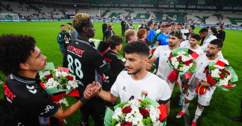 Konyaspor and Palestine national team players exchange flowers after the friendly match at Konya Büyükşehir Stadium, Konya, Türkiye, Sept. 30, 2026. (AA Photo)