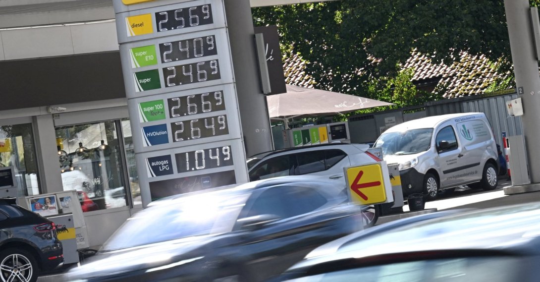 Cars drive past a display board showing the current prices of petrol and diesel at a gas station in Munich, Germany, Sept. 14, 2026. (Reuters Photo)