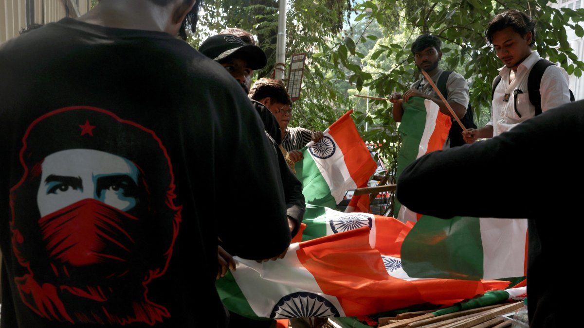 Supporters of the Cockroach Janta Party (CJP) arrange national flags outside Shivaji Park ahead of a protest demanding the resignation of India's Chief Election Commissioner, Gyanesh Kumar, Mumbai, India, Oct. 2, 2026. (Reuters Photo)