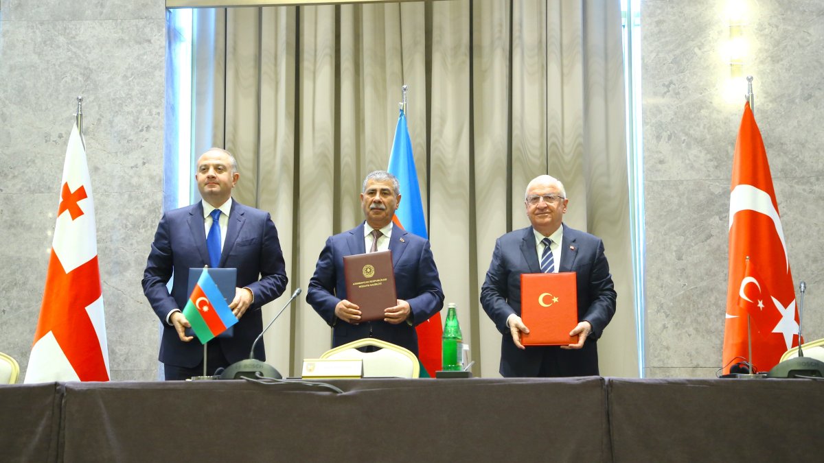 Turkish Defense Minister Yaşar Güler (R), Azerbaijani Defense Minister Zakir Hasanov (C) and Georgian Defense Minister Irakli Chikovani (L) sign the meeting protocol, Shusha, Azerbaijan, Oct. 2, 2026. (AA Photo)