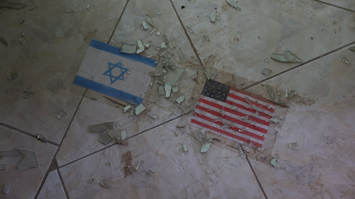 Flags of the U.S. and Israel on the ground at a school, which was damaged in a strike on Feb. 28, Lamerd, Iran, Sept. 12, 2026. (Reuters Photo)