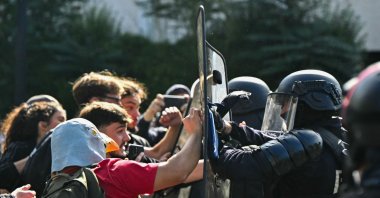 Anti-riot police officers face protesting students carrying out a blockade outside the secondary school Le Corbusier, in Aubervilliers, Paris, France, Oct. 1, 2026. (AFP Photo)