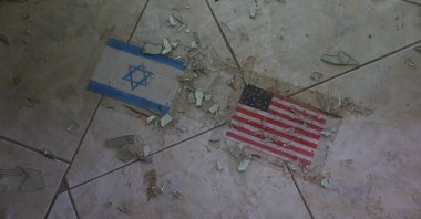 Flags of the U.S. and Israel on the ground at a school, which was damaged in a strike on Feb. 28, Lamerd, Iran, Sept. 12, 2026. (Reuters Photo)
