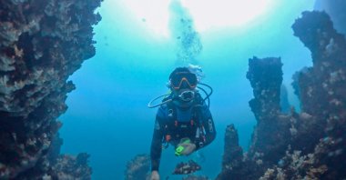 A scientist dives in Lake Van to collect samples for an international research project, Van, Türkiye, Oct. 2, 2026. (AA Photo)