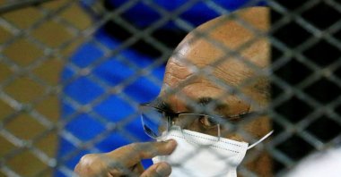 Sudan's ousted President Omar al-Bashir is seen inside the defendant's cage during his trial, Khartoum, Sudan, Sept. 15, 2020. (Reuters Photo)