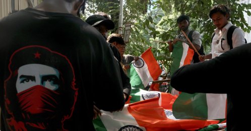 Supporters of the Cockroach Janta Party (CJP) arrange national flags outside Shivaji Park ahead of a protest demanding the resignation of India's Chief Election Commissioner, Gyanesh Kumar, Mumbai, India, Oct. 2, 2026. (Reuters Photo)