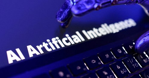 The words "AI Artificial Intelligence," a keyboard and a robotic hand are shown in this illustration, June 5, 2026. (Reuters Photo)