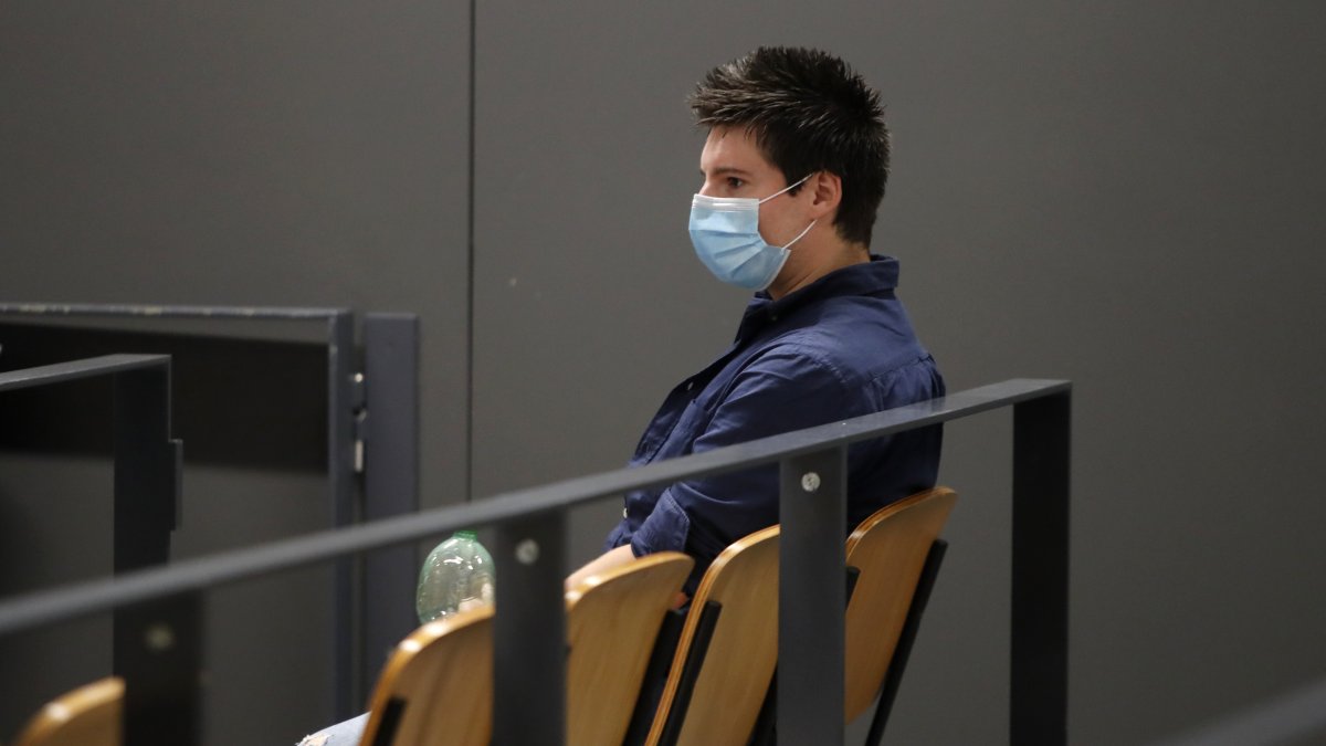 Portuguese hacker Rui Pinto sits in the courtroom at the start of his trial, Lisbon, Portugal, Sept. 4, 2020. (AP Photo)