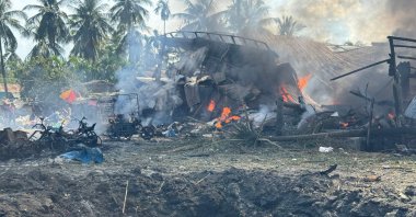 Smoke billows from fires in a residential area following a military airstrike on a market and adjacent bridge, Kyauktaw, Western Rakhine State, Sept. 28, 2026. (AFP Photo)