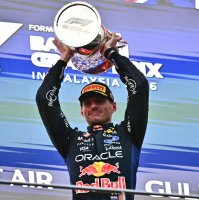 Race winner Red Bull Racing's Dutch driver Max Verstappen lifts his trophy during podium ceremony of the F1 Bahrain GP in Sepang, Malaysia, Oct. 4, 2026. (AFP Photo)