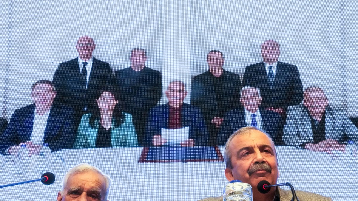 A DEM Party delegation releases a statement from Abdullah Öcalan (C background) at a news conference, Istanbul, Türkiye, Feb. 27, 2025. (AP Photo)