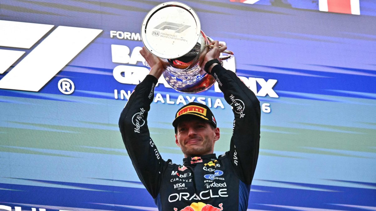 Race winner Red Bull Racing's Dutch driver Max Verstappen lifts his trophy during podium ceremony of the F1 Bahrain GP in Sepang, Malaysia, Oct. 4, 2026. (AFP Photo)