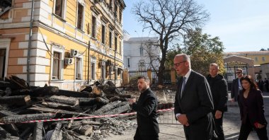 Ukraine's President Volodymyr Zelenskyy, German Chancellor Friedrich Merz visit the site of an administrative building of Ukraine's National Academy of Sciences hit during recent Russian drone strikes, in Kyiv, Ukraine, Oct. 4, 2026. (Reuters Photo)