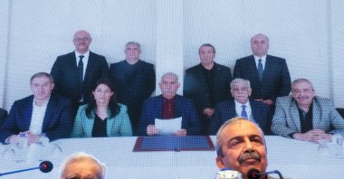 A DEM Party delegation releases a statement from Abdullah Öcalan (C background) at a news conference, Istanbul, Türkiye, Feb. 27, 2025. (AP Photo)