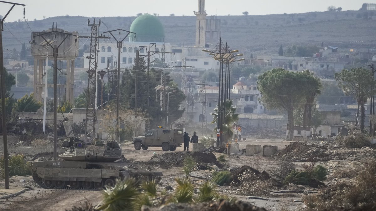 Israeli armored vehicles block a road leading to the town of Quneitra, Syria, Jan. 5, 2025. (AP Photo)
