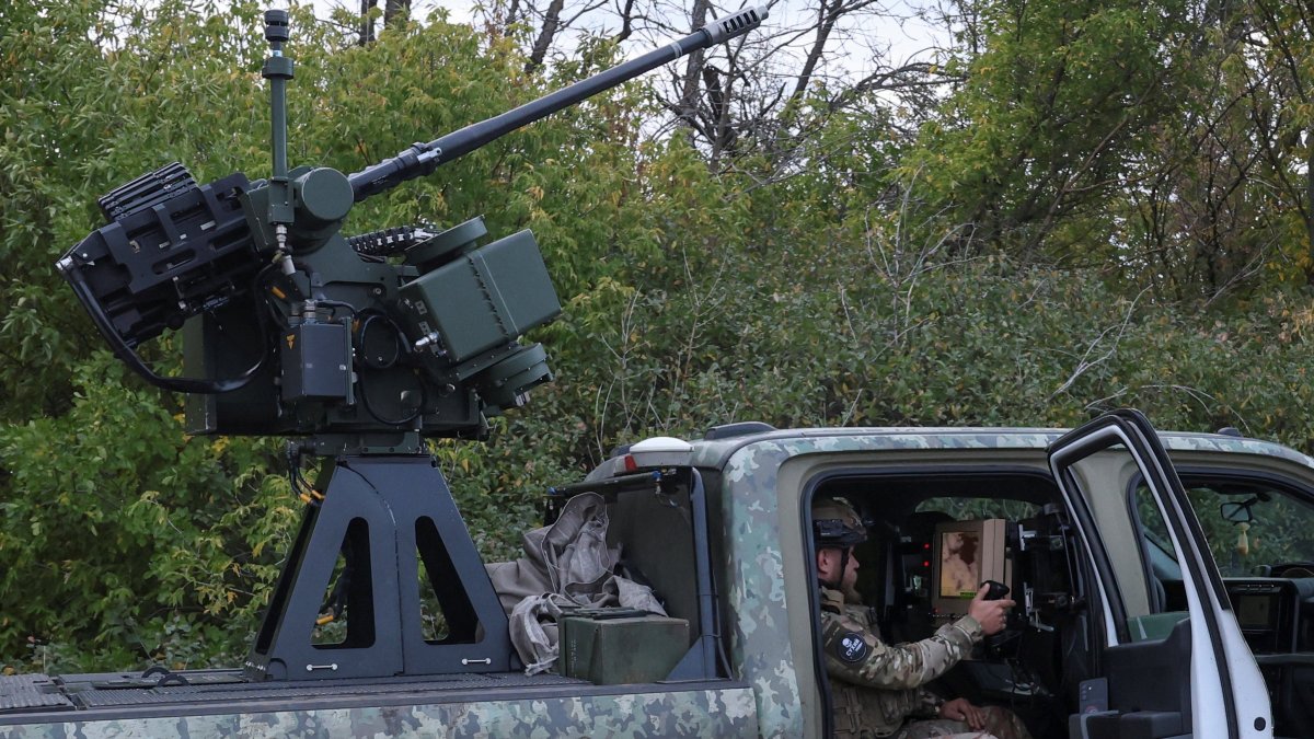 A serviceman of the 1030th Separate Anti-Aircraft Missile and Artillery Regiment 'Aquila' checks an Australian-made "Slinger" automated turret during his combat shift, amid Russia's attack on Ukraine, in Kharkiv region, Ukraine, Sept. 26, 2026. (Reuters Photo)