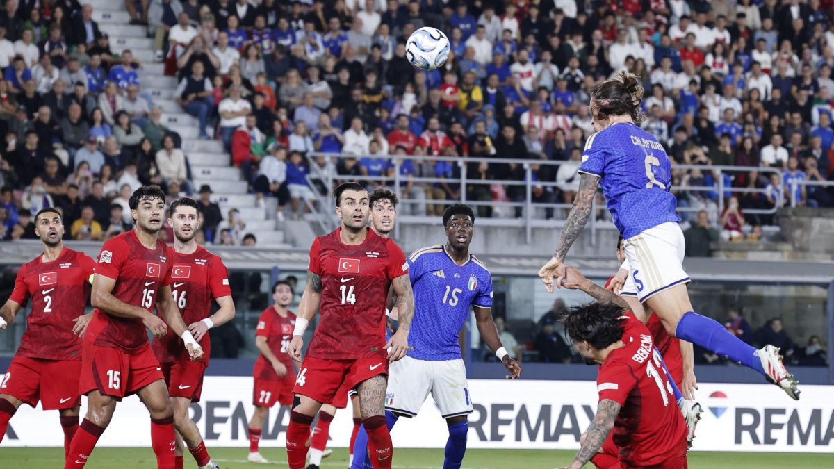 Italy's Riccardo Calafiori (up) scores the 2-1 goal during the UEFA Nations League soccer match between Italy and Türkiye at Renato Dall'Ara stadium in Bologna, Italy, Oct. 5, 2026.  (EPA Photo)