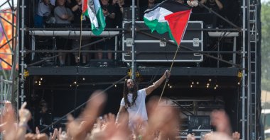 Bob Vylan waves a Palestinian flag as he performs on the West Holts stage during day four of Glastonbury Festival 2025, Glastonbury, England, U.K., June 28, 2025. (Getty Images Photo)