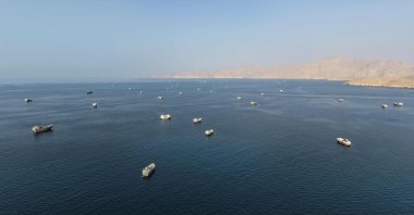 An aerial view shows ships anchored off the coast of Khasab in Oman's Musandam Governorate, near the Strait of Hormuz, Oct. 2, 2026.