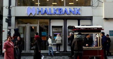 People walk past a branch of Halkbank in central, Istanbul, Türkiye, Jan. 22, 2020. (Reuters Photo)