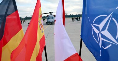 (L-R) German, Spanish, Canadian and NATO flags are seen during a NATO Media Day at Lielvarde Air Base, Latvia, Oct. 1, 2026. (EPA Pho