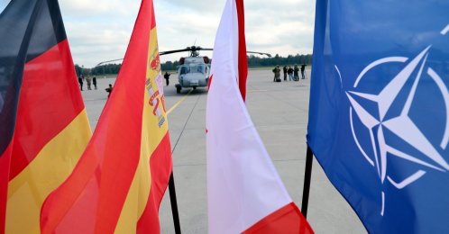 (L-R) German, Spanish, Canadian and NATO flags are seen during a NATO Media Day at Lielvarde Air Base, Latvia, Oct. 1, 2026. (EPA Pho