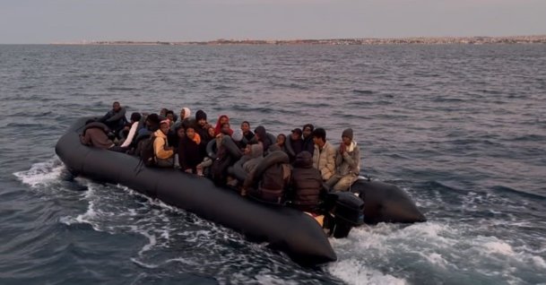 Turkish coast guard teams rescue 62 irregular migrants, including 28 children, from a rubber boat off the coast of Didim, Aydın, western Türkiye, Sept. 28, 2026. (IHA Photo)