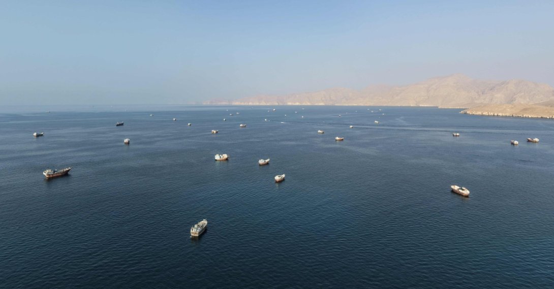 An aerial view shows ships anchored off the coast of Khasab in Oman's Musandam Governorate, near the Strait of Hormuz, Oct. 2, 2026.