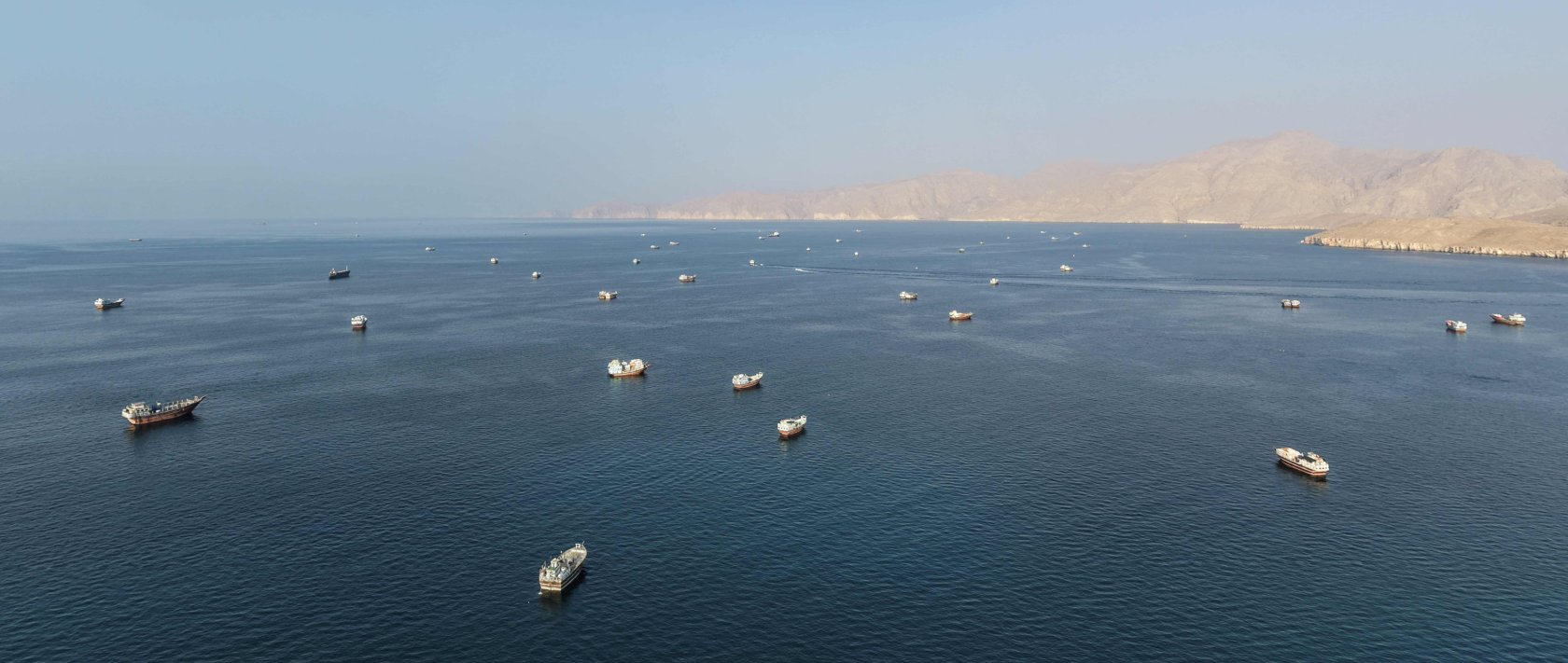 An aerial view shows ships anchored off the coast of Khasab in Oman&amp;#039;s Musandam Governorate, near the Strait of Hormuz, Oct. 2, 2026.