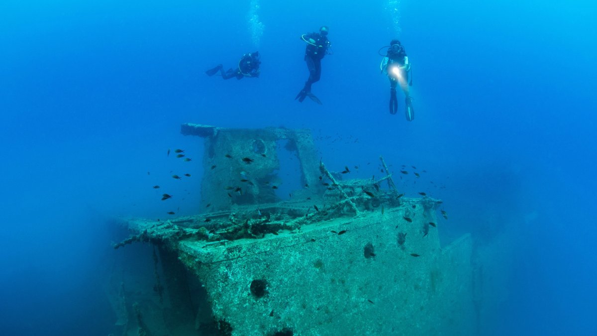 Divers explore a shipwreck, near the sites of the Gelidonya and Uluburun shipwrecks, Antalya, Türkiye, Sept. 11, 2026. (DHA Photo)