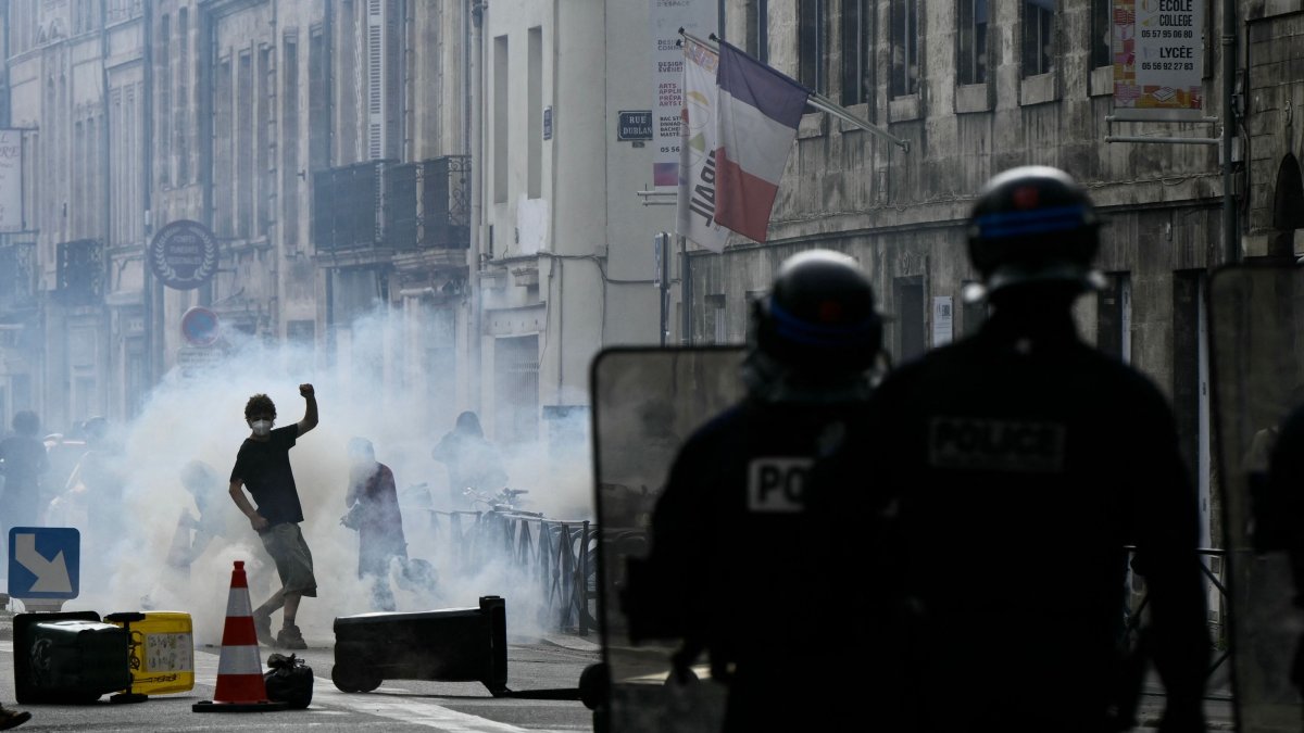 Police officers stand after firing a tear gas canister to disperse remaining protesters at the end of a demonstration, part of a nationwide day of actions called by high-school students, joined by unions and teachers, in Bordeaux, France, Oct. 6, 2026. (AFP Photo)