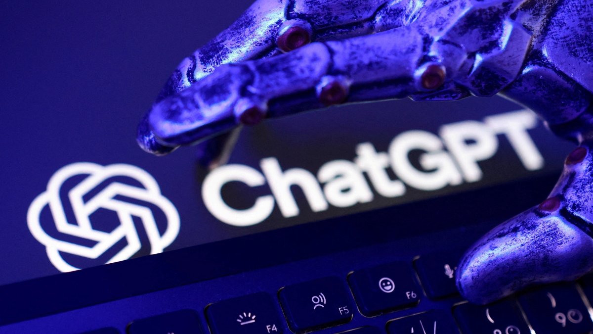 ChatGPT logo, a keyboard, and a robotic hand in this illustration taken June 5, 2026. (Reuters Photo)