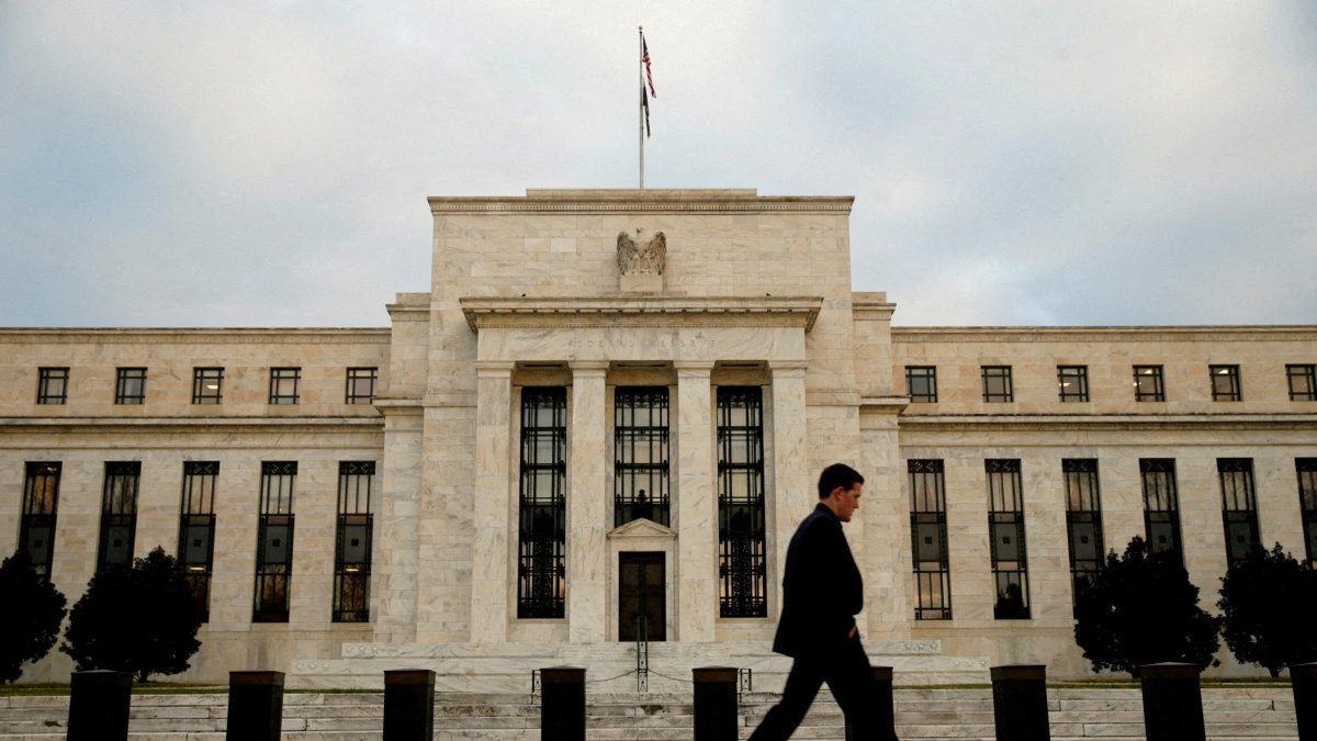 A man walks past the Federal Reserve in Washington, Dec. 16, 2015. (Reuters File Photo)