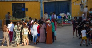 Women migrants and children gather in an industrial area in Ceuta, Spain, Aug. 3. (AFP File Photo)