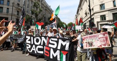 Protesters hold up signs on the front line of the National March for Palestine “Zionism is racism”, London, England, U.K., July 18, 2026. (Shutterstock Photo)