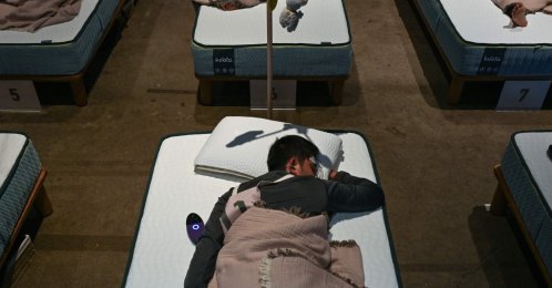 An attendee takes part in a sleep competition organized by a mattress brand, Tokyo, Japan, Oct. 5, 2026. (AFP Photo)