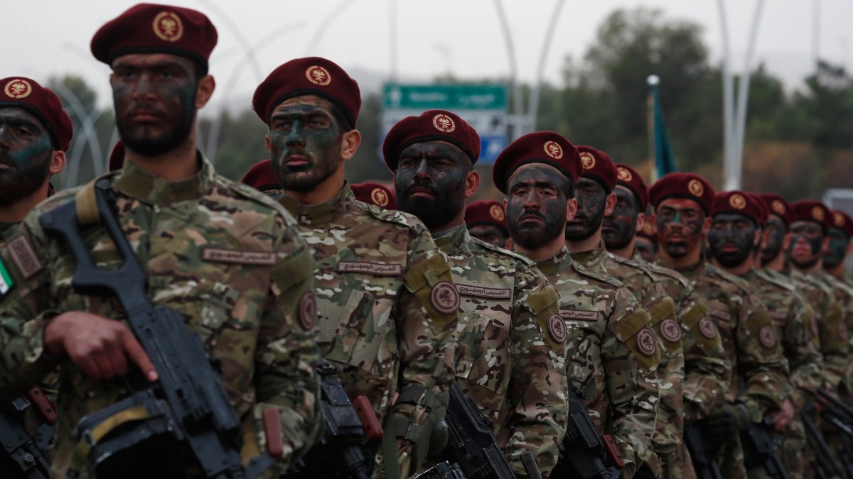 New Syrian army troops stand in formation during celebrations marking the first anniversary of the ousting of Bashar Assad, in Damascus, Syria, Dec. 8, 2025. (AP Photo)