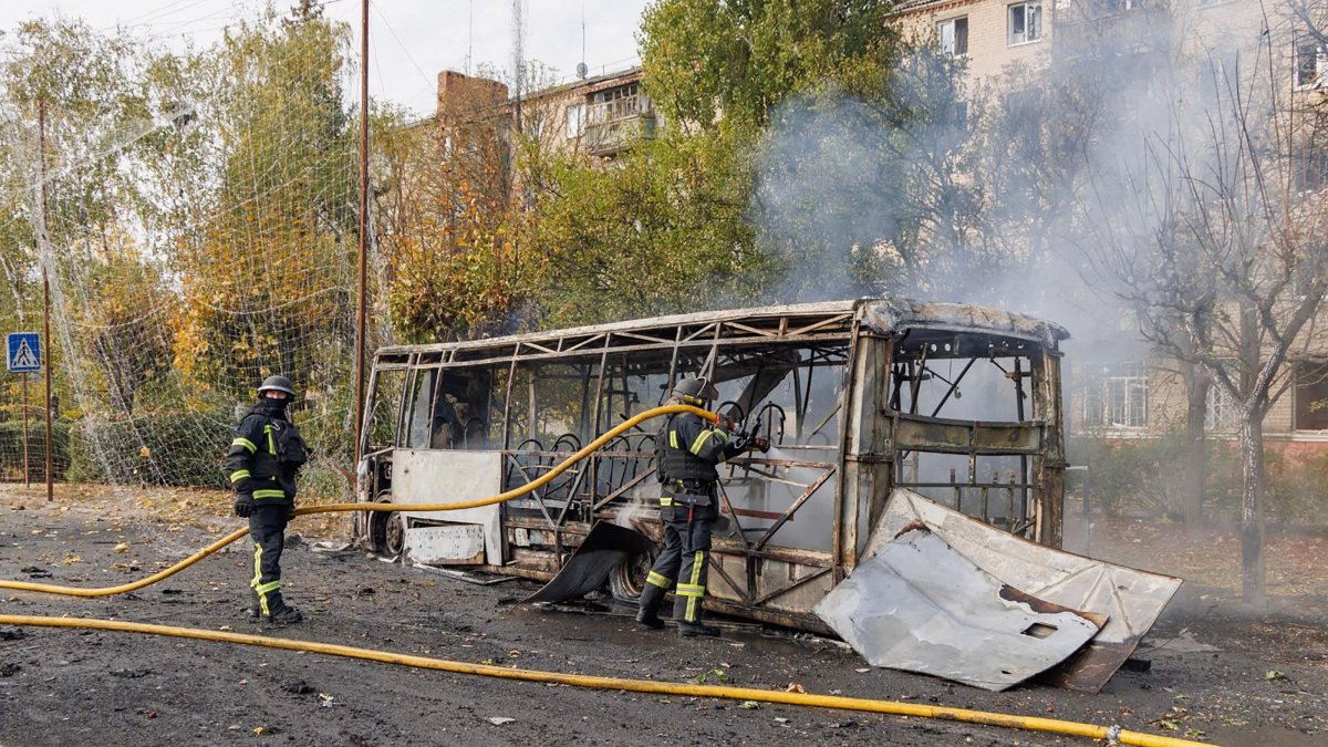 Firefighters working at the scene where two buses were struck by projectiles in Kramatorsk, eastern Ukraine, Oct. 8, 2026. (AFP Photo)