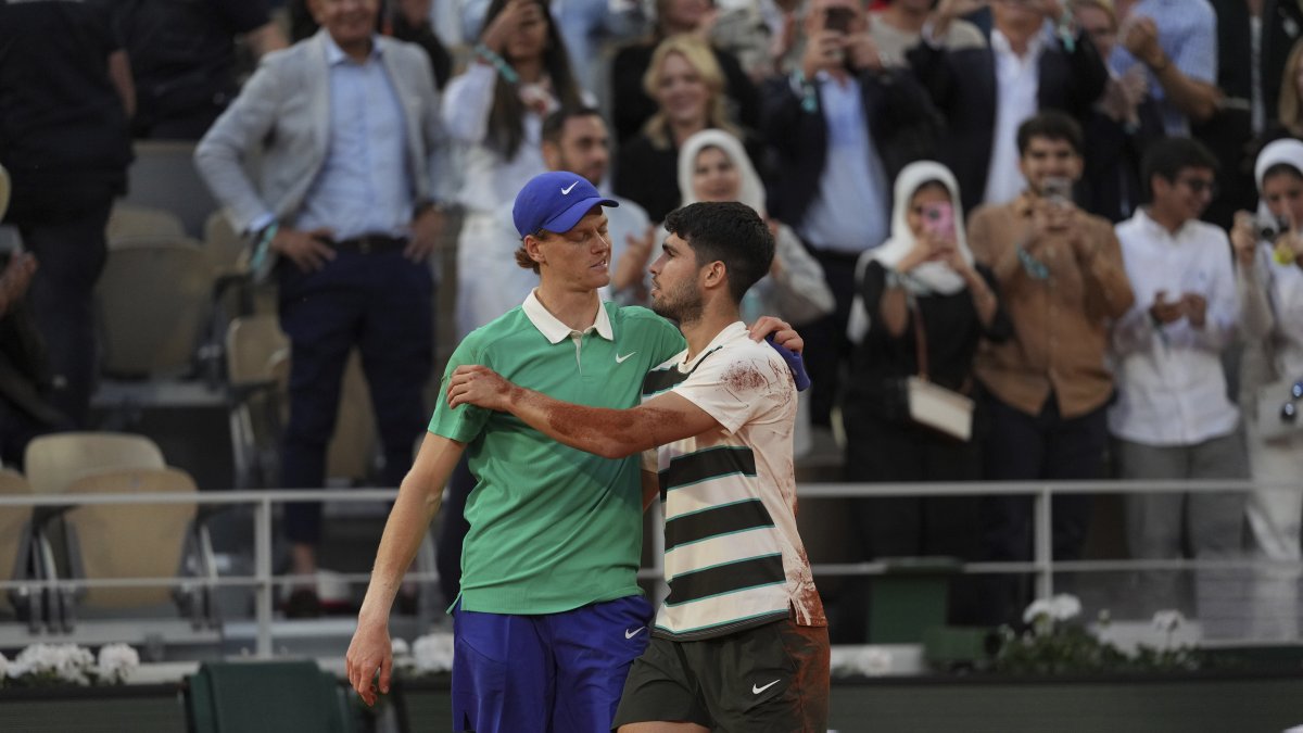 Spain's Carlos Alcaraz (R) and Italy's Jannik Sinner hug after the final match of the French Open at the Roland-Garros Stadium, Paris, France, June 8, 2025. (AP Photo)
