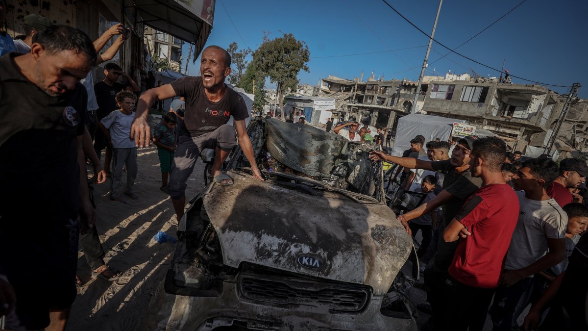 Locals inspect the site of an Israeli attack in Tel al-Hava neighborhood, Gaza Strip, Palestine, Oct. 8, 2026. (AA Photo)