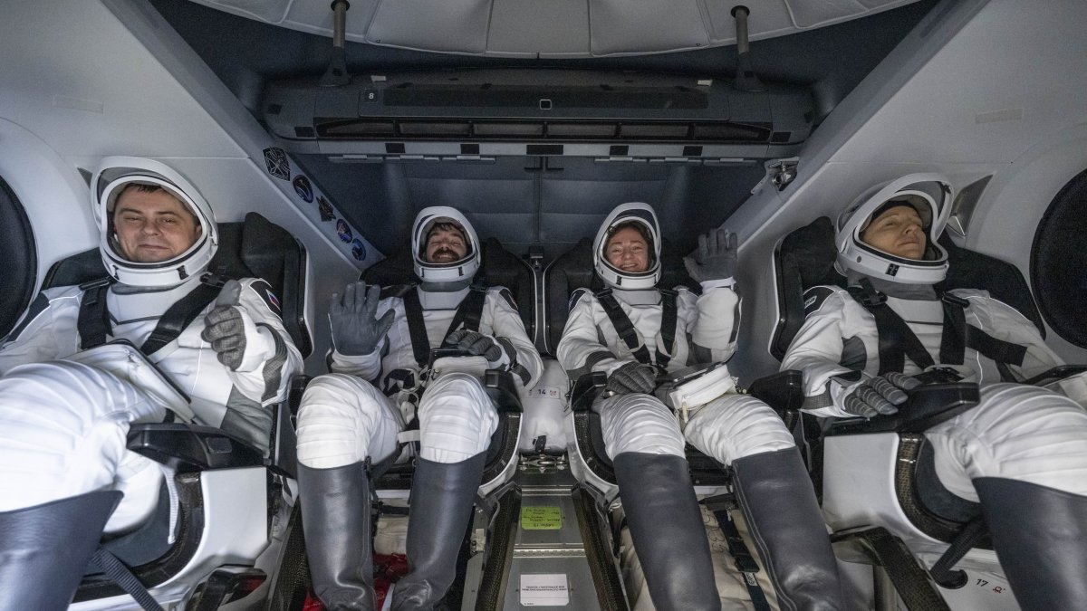 A handout picture made available by the National Aeronautics and Space Administration (NASA) shows Roscosmos cosmonaut Andrey Fedyaev, left, NASA astronauts Jack Hathaway and Jessica Meir, and ESA (European Space Agency) astronaut Sophie Adenot are seen inside the SpaceX Dragon Freedom spacecraft onboard the SpaceX recovery ship SHANNON shortly after having landed in the Pacific Ocean off the coast of Los Angeles, California, Oct. 8, 2026. (NASA Handout via EPA)