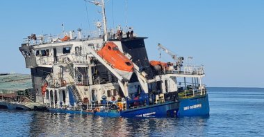 The cargo ship Royad Mammadov remains half-submerged after being hit by a drone in Romania’s territorial waters, killing two Azerbaijani crew members, Black Sea, Oct. 5, 2026. (Reuters Photo)