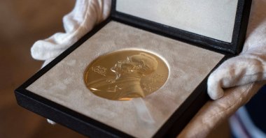 A Nobel medal is seen at the Swedish ambassador's residence, London, U.K., Dec. 8, 2020. (AP Photo)